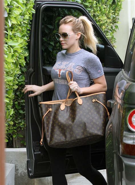 celebrities with lv neverfull bag|celebrities with luggage.